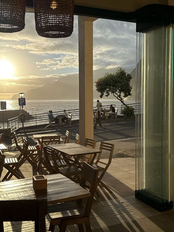 Obsidian 17's terrace at sunset, with the ocean and the mountains behind